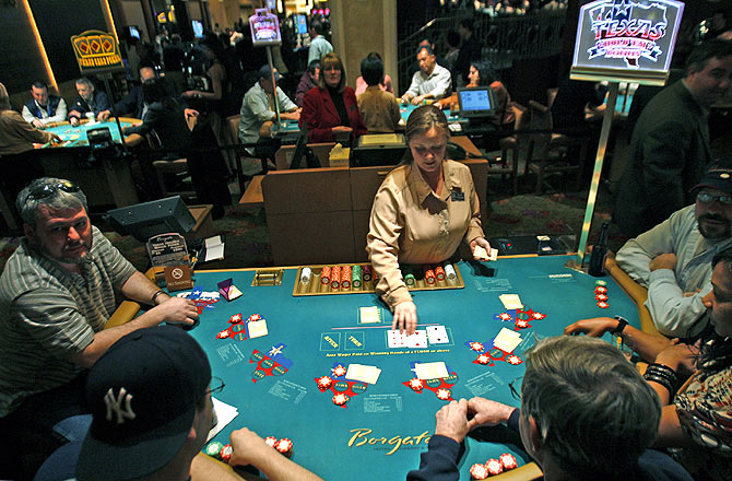 A dealer works at a poker table at the Borgata casino in Atlantic City, New Jersey.