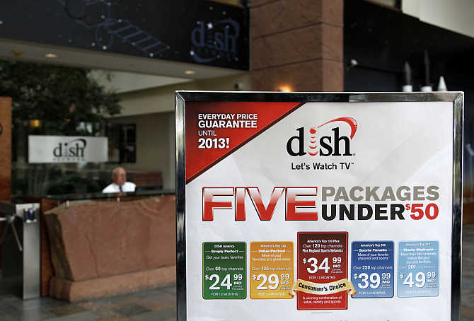 A sign in the lobby of the corporate headquarters of Dish Network shows prices of packages in the Denver suburb of Englewood, Colorado.