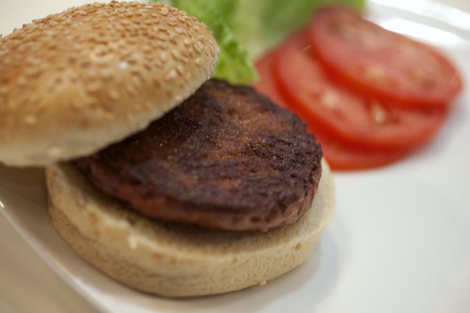 The world's first lab-grown beef burger is seen after it was cooked at a launch event in west London.