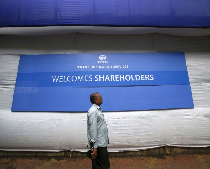  A shareholder arrives for the Tata Consultancy Services (TCS) annual general meeting.