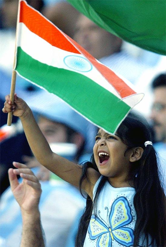 An Indian child waves the national flag.