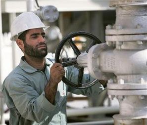 An Iranian oil worker on the Persian Gulf coast. Photograph: Morteza Nikoubazl/Reuters
