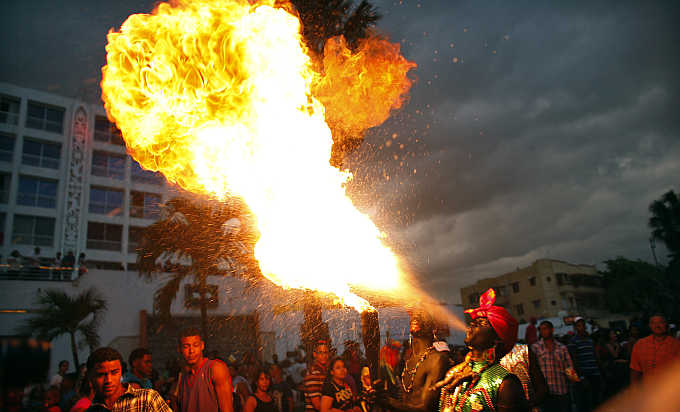 Revellers take part in the annual national carnival in Santo Domingo, Haiti.
