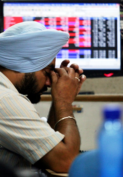 An investor reacts at a local stock market in Chandigarh.