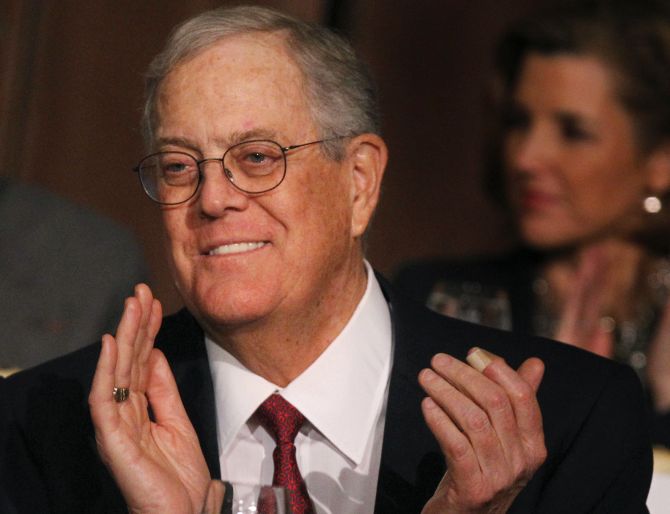 David Koch, executive vice president of Koch Industries, applauds during an Economic Club of New York event in New York.