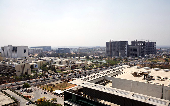 An elevated view shows a newly-built highway and the Gachibowli district in Hyderabad