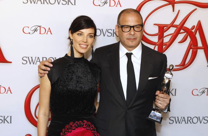 Actress Jessica Pare (L) smiles with designer Reed Krakoff after Krakoff won the award for Accessory Designer of the Year at the 2012 Council of Fashion Designers of America (CFDA) Fashion Awards in New York.