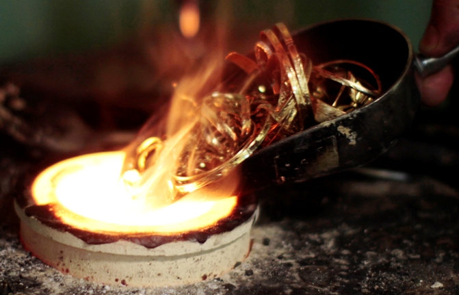 A goldsmith melts down gold jewellery in Los Angeles, California.
