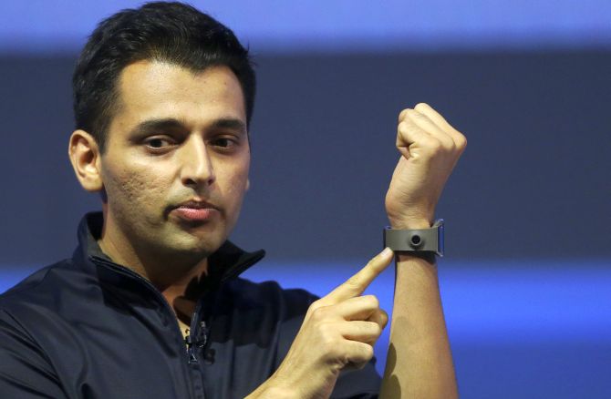 Pranav Mistry, head of the think tank team, Samsung Research America points to the so-called 'Memographer' camera on a Samsung Galaxy Gear smartwatch during its launch at the 'Samsung UNPACKED 2013 Episode 2' at the IFA consumer electronics fair in Berlin.