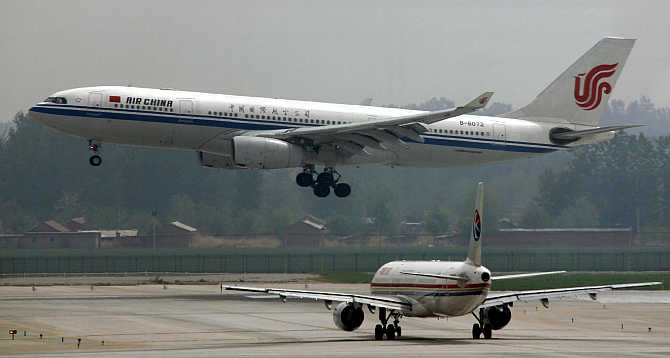 An Air China Airbus A330-243 aeroplane descends to land at Beijing airport, China.