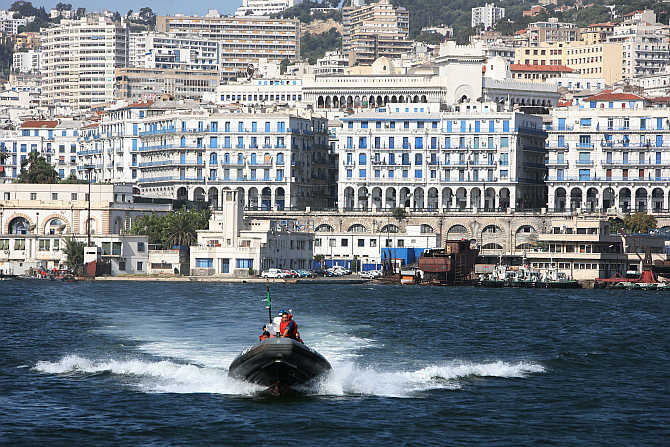 Coastguards cross the bay of the Mediterranean port of Algiers, Algeria.
