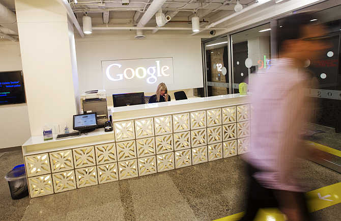 A man walks by the reception desk at the Google office in Toronto, Canada.