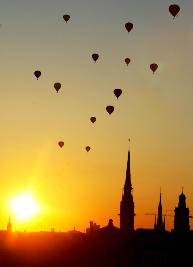 Air balloons sail off into the sunset after participating in a Nordic competition over Stockholm, Salt lake.