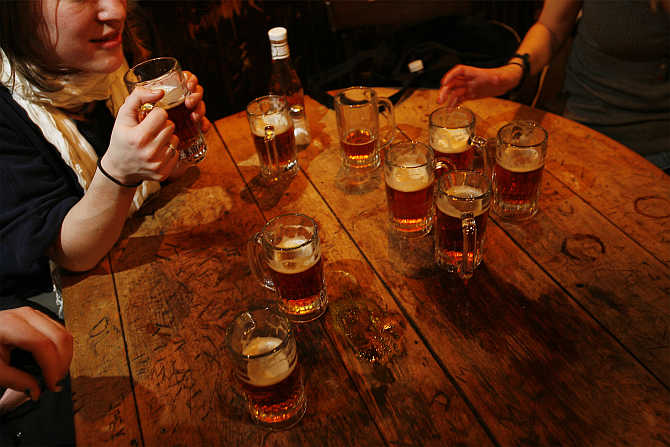 A round of beers sit on a table inside McSorley's Old Ale House in New York City.