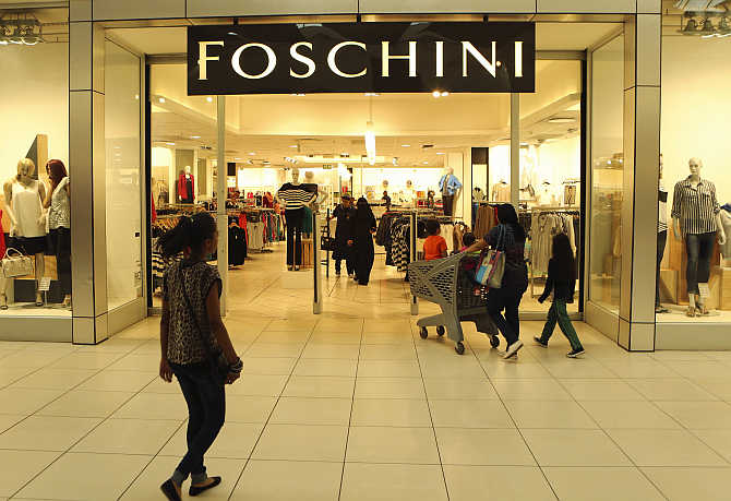A shopper walks past a Foschini store at a shopping centre in Lenasia, south of Johannesburg, South Africa.