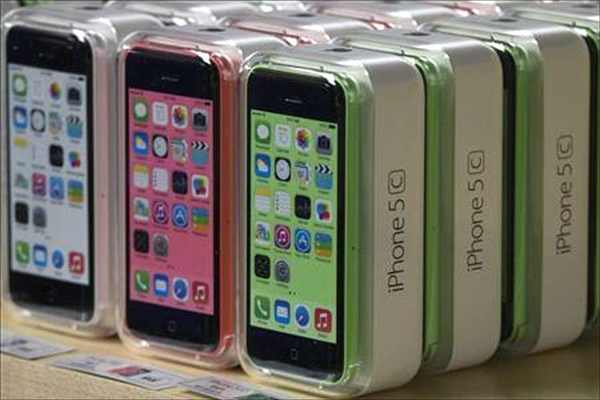 Apple iPhone 5c phones at the Apple retail store on Fifth Avenue in Manhattan, New York.