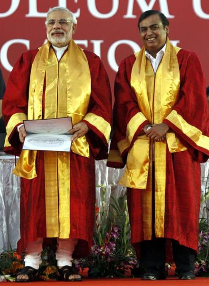 Narendra Modi (L) and Mukesh Ambani, attend a convocation ceremony at Pandit Deendayal Petroleum University in Gujarat.