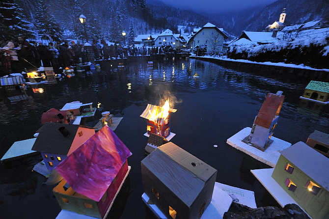 Floats lit with candles are seen as they are released by children on a river in Kropa on St Gregory's Day in Slovenia. The event marks the arrival of spring and symbolises the releasing of light.