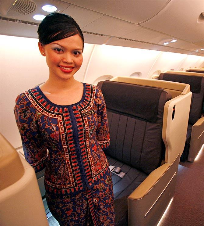 A stewardess posing for a photo in the business class cabin Airbus A380 superjumbo after it landed in Singapore.