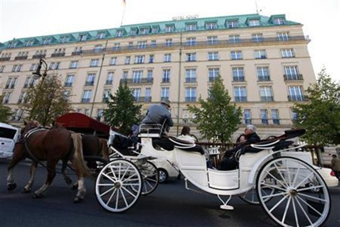 A carriage passes in front of the Hotel Adlon at the Pariser Platz in Berlin.