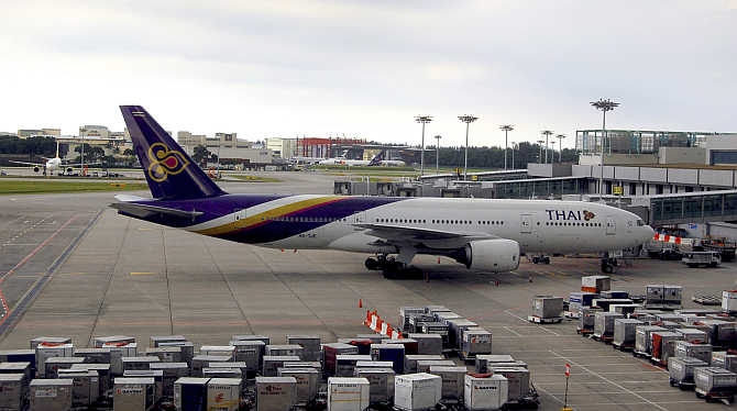 A Thai Airways plane sits on the tarmac at Singapore's Changi Airport.