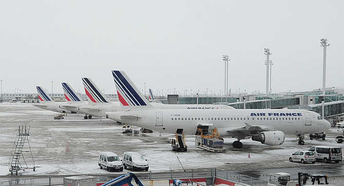 Air France planes on the snow covered tarmac at the Charles-de-Gaulle airport in Roissy, near Paris.