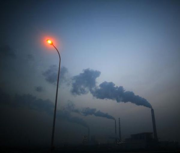 Smoke rises from chimneys of a thermal power plant near Shanghai March 26, 2014. 