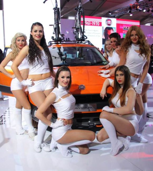 Models surround Fiat's Avventura during the Indian Auto Show.