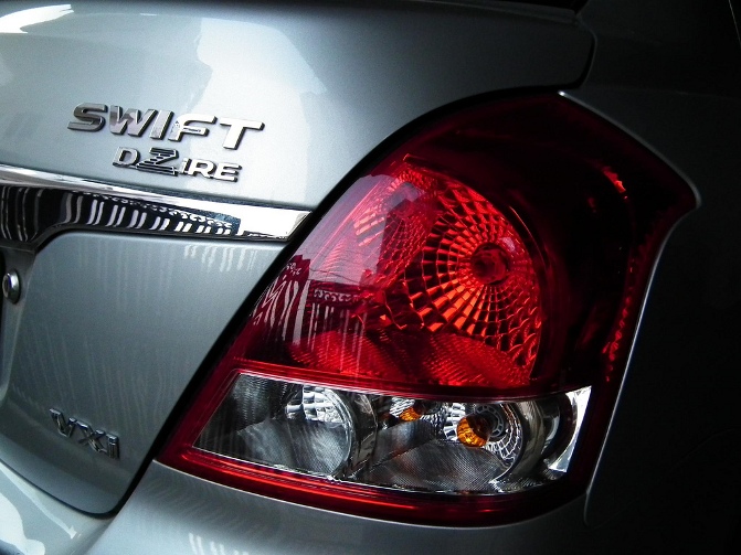 The Maruti Suzuki Swift Dzire back side logo.