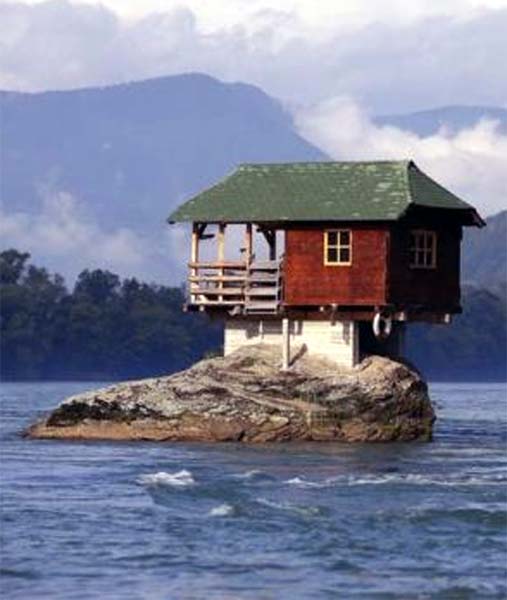 A house built on a rock on the river Drina is seen near the western Serbian town of Bajina Basta, about 160km (99 miles) from the capital Belgrade.