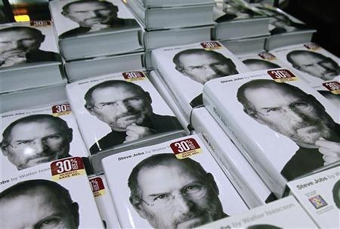 Copies of the new biography of Apple CEO Steve Jobs by Walter Isaacson are displayed at a bookstore in New York .