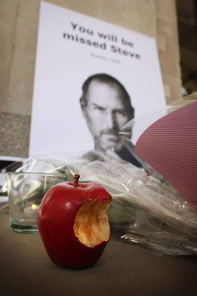 Tributes to Apple Computer co-founder Steve Jobs are placed outside The Apple Store in Covent Garden.
