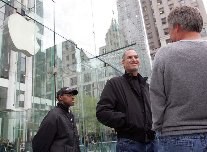 Steve Jobs looking at the crowds at the opening of the an Apple Store on 5th Avenue in New York.