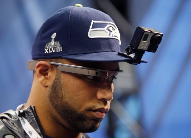 Seattle Seahawks wide receiver Golden Tate wears Google Glasses and a GoPro camera on his hat as he is interviewed during Media Day for Super Bowl XLVIII at the Prudential Center in Newark, New Jersey January 28, 2014.