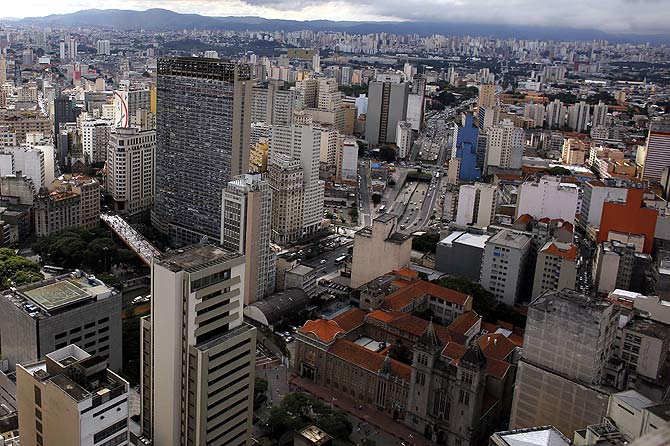 A general view shows the Sao Bento Monastery (R) between skyscrapers at downtown Sao Paulo.