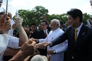 Narendra Modi and Japan PM Shinzo Abe shake hands with visitors at the Toji Temple in Kyoto. Photograph: MEA/Facebook