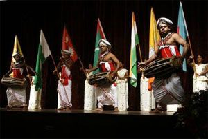 Sri Lankan traditional drummers perform in front of the South Asian Association of Regional Corporation countries national flags. Photograph: BUDDHIKA WEERASINGHE/REUTERS