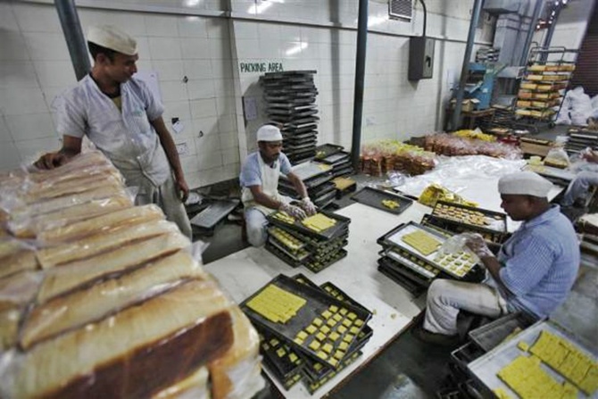 Inmates prepare cookies at a bakery inside the Tihar Jail complex in New Delhi.