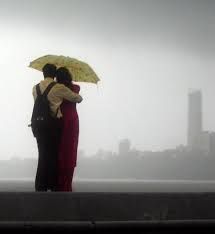 A couple enjoying the monsoon rains in Mumbai.