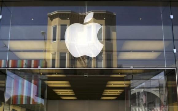 The Apple logo is pictured on the front of a retail store in the Marina neighborhood in San Francisco, California April 23, 2014. 