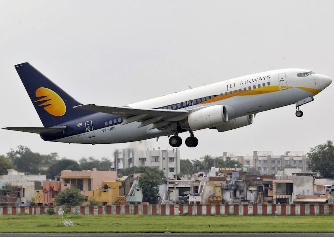 A Jet Airways passenger aircraft takes off from the Ahmedabad airport.