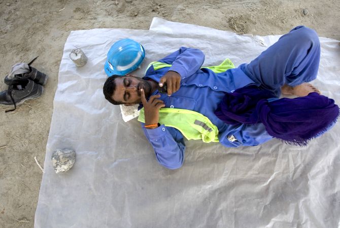 A labourer takes a break at a construction site near the Dubai Mall.