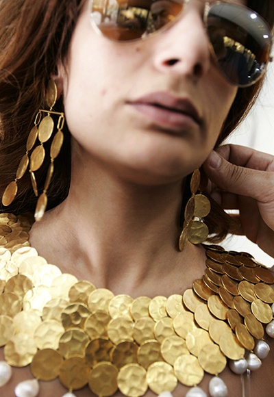 A model wearing gold jewellery.