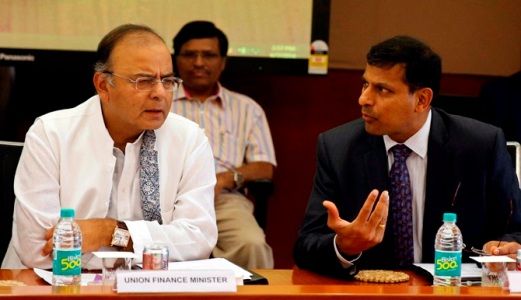 Arun Jaitley (L) listens to Reserve Bank of India Governor Raghuram Rajan during a financial stability development council meeting in Mumbai June 7, 2014. 