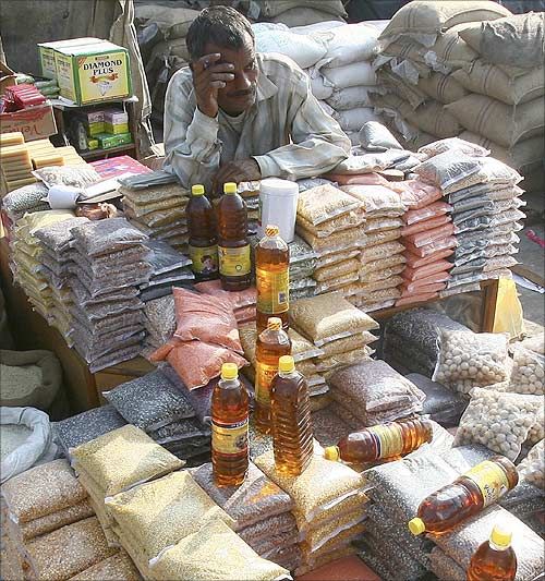 A salesman waits for customers at a grocery wholesale market in Chandigarh.