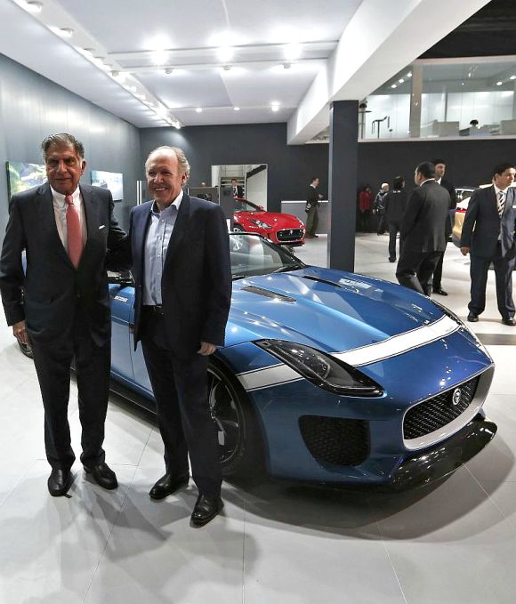 Indian businessman Ratan Tata, former chairman of the Tata Group, and Ian Callum (R), design director at Jaguar, stand next to the Jaguar Project 7 concept car.