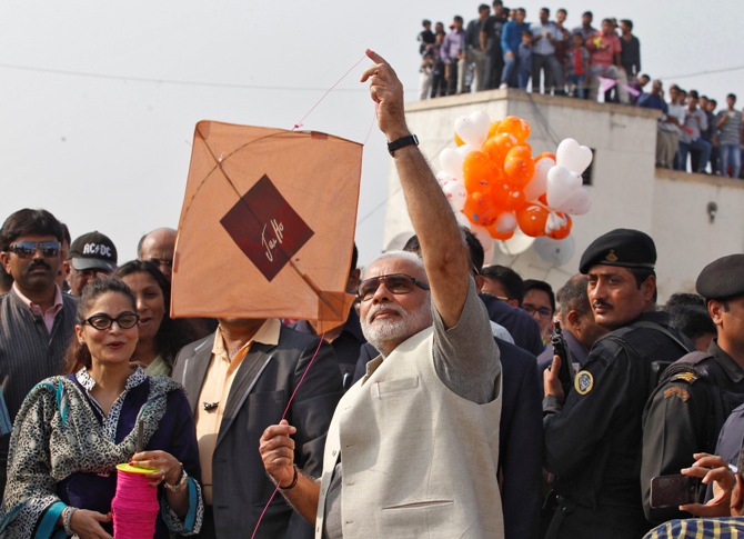 Narendra Modi flies a kite during a kite flying festival in Ahmedabad.