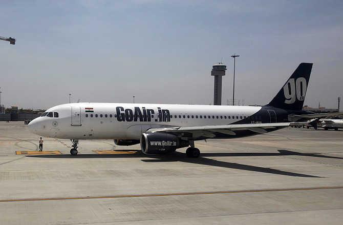 A GoAir aircraft taxis on the tarmac at Bangalore International Airport.