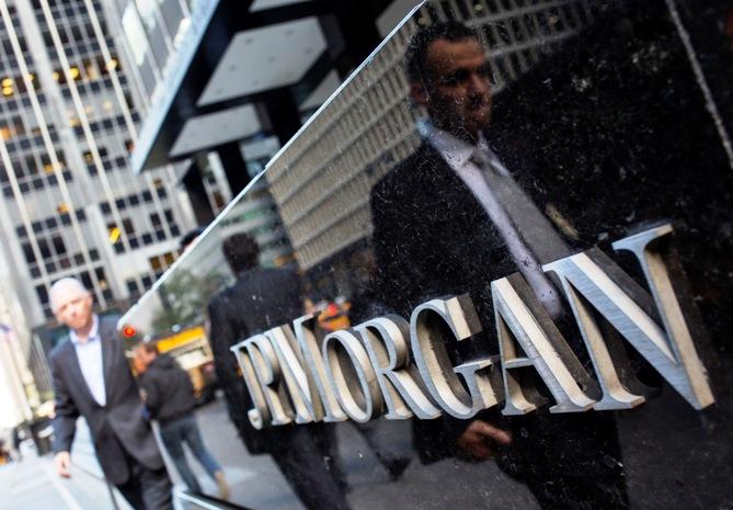 People walk by the JP Morgan & Chase Co. building in New York.