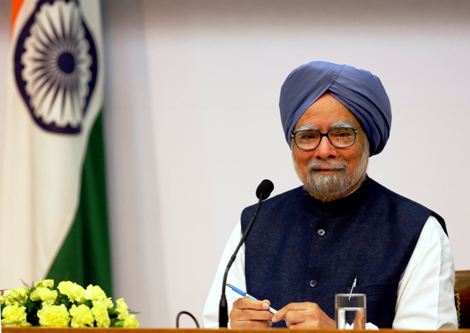 Prime Minister Manmohan Singh smiles during a press conference in New Delhi.
